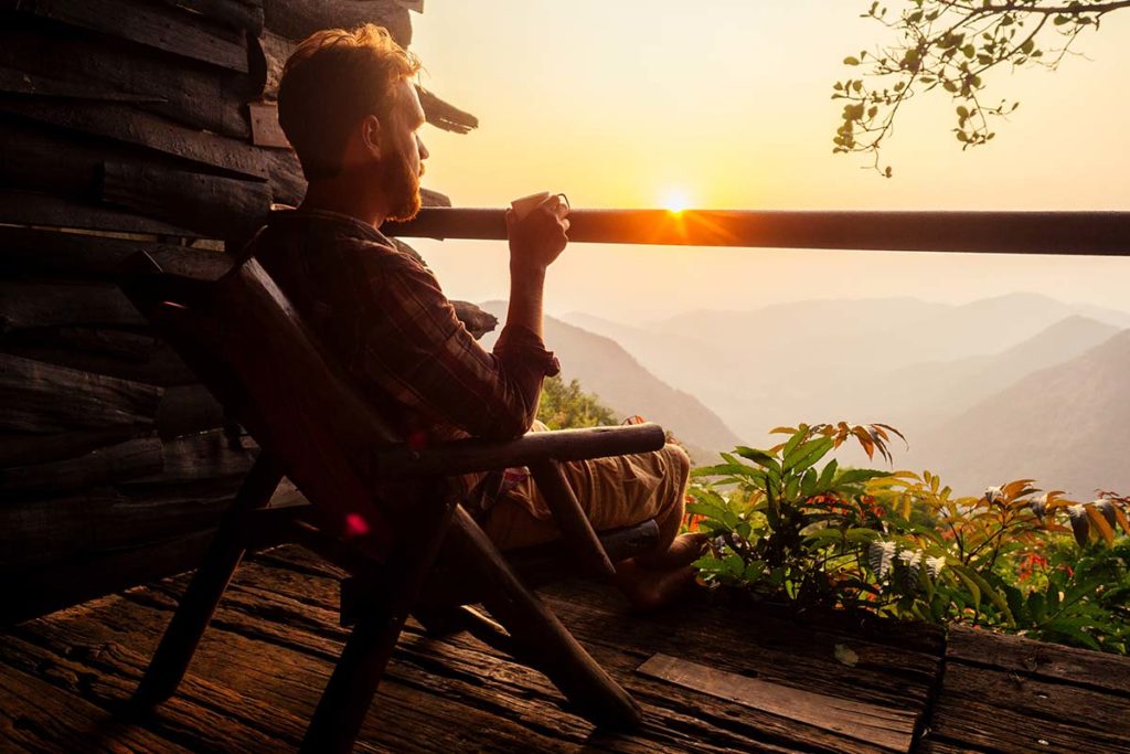 a person enjoys the sunset as they progress through the stages of addiction recovery