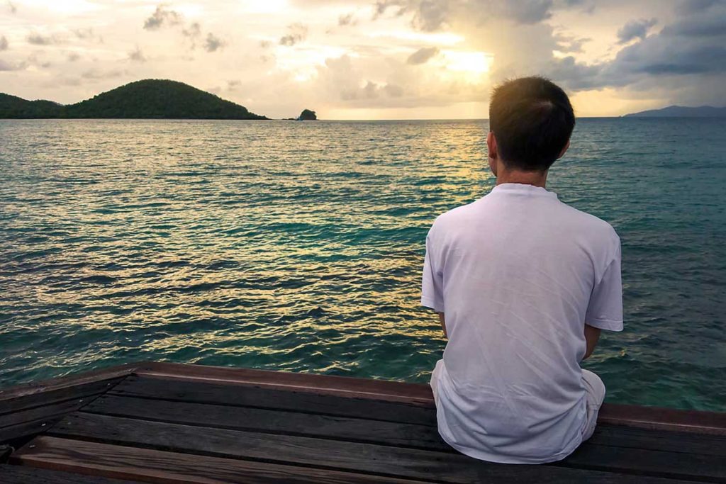a person looks on the ocean pondering dangers of fentanyl